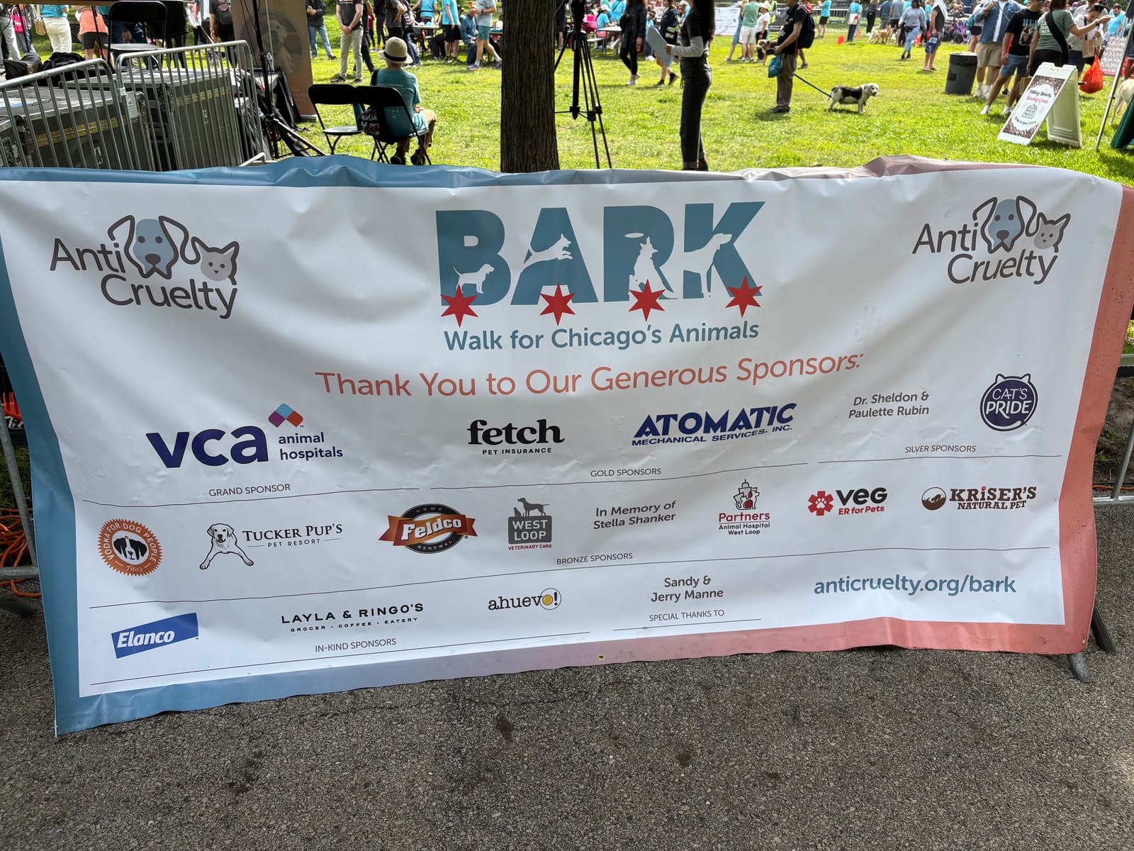 The BARK โ Walk for Chicago's Animals sponsor banner at the Anti-Cruelty Society event